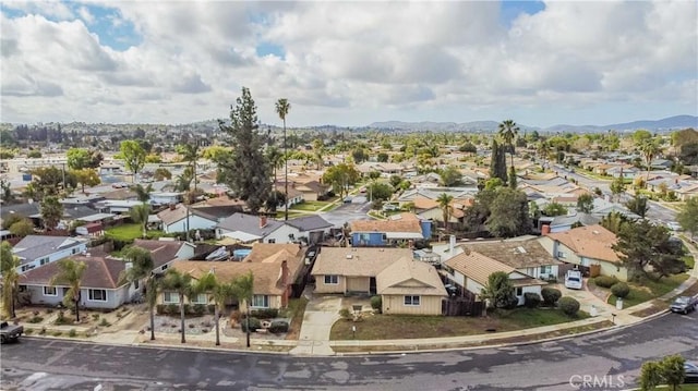 birds eye view of property with a residential view