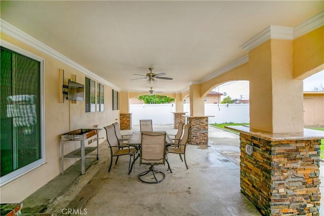 view of patio featuring ceiling fan, fence, and outdoor dining area