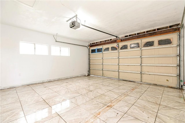 garage featuring a garage door opener