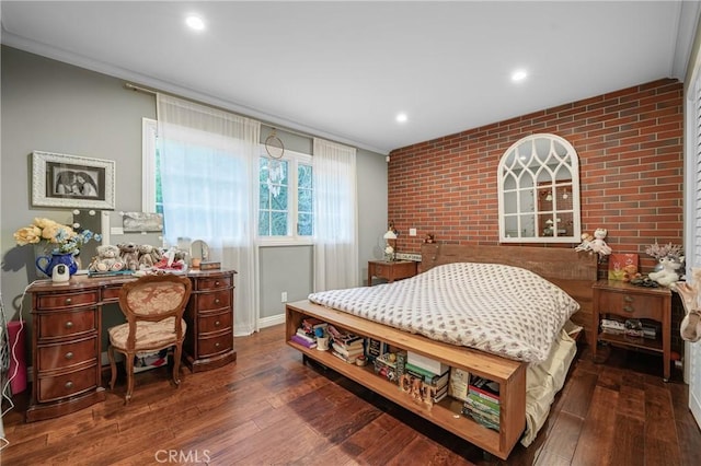 bedroom with brick wall, hardwood / wood-style floors, recessed lighting, and crown molding