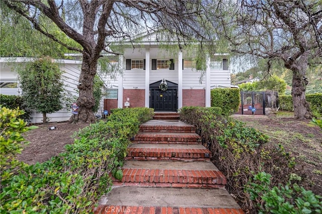 view of front of house with brick siding