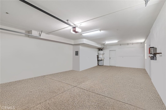 garage featuring a garage door opener and electric panel