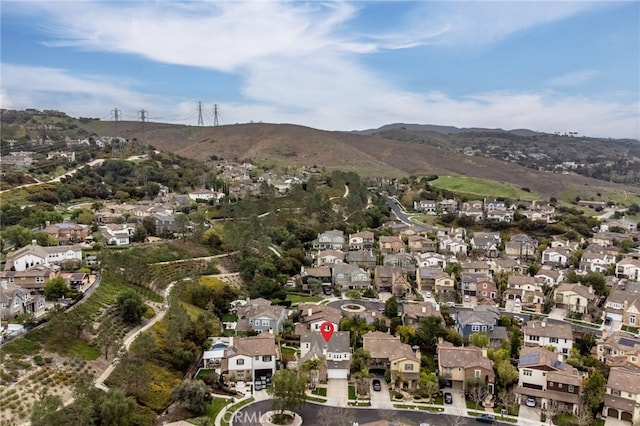 birds eye view of property with a mountain view and a residential view