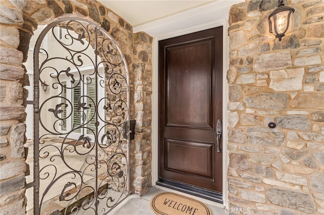 view of exterior entry with a gate