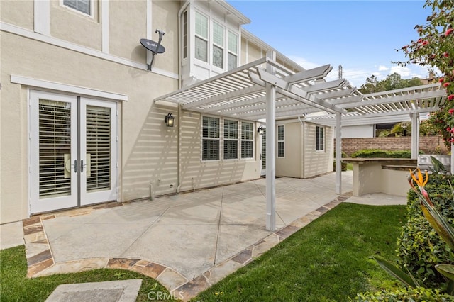 view of patio featuring french doors and a pergola