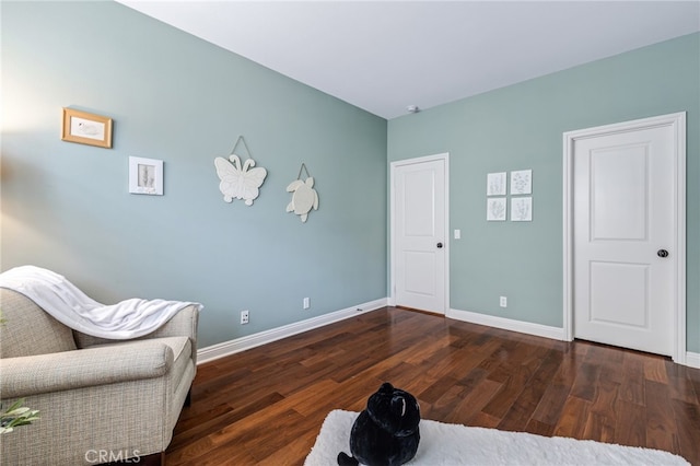 sitting room with wood finished floors and baseboards