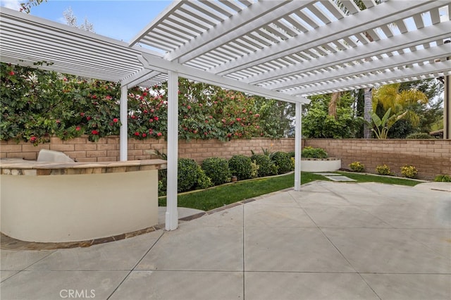 view of patio featuring fence