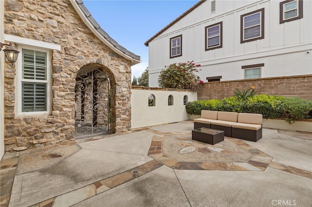 view of patio / terrace featuring fence and an outdoor hangout area