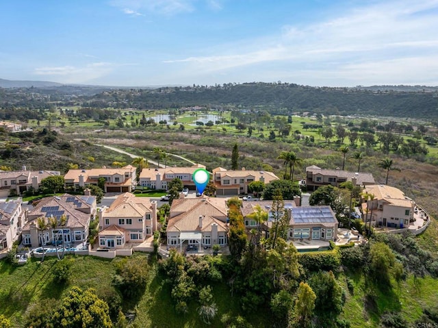 birds eye view of property with a residential view