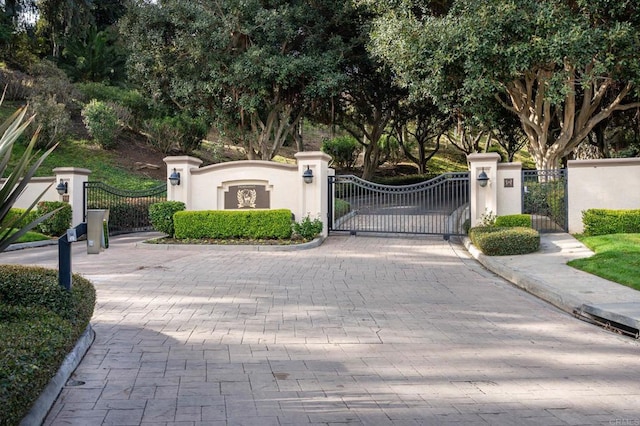 view of gate featuring fence