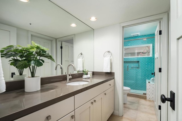 full bath with toilet, recessed lighting, a stall shower, tile patterned floors, and vanity