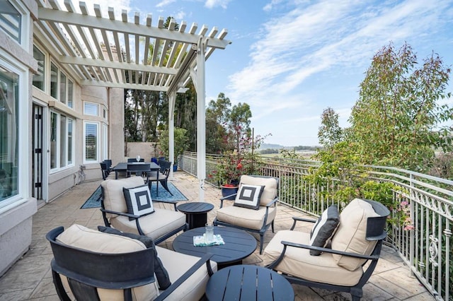 view of patio / terrace featuring outdoor dining space, outdoor lounge area, and a pergola