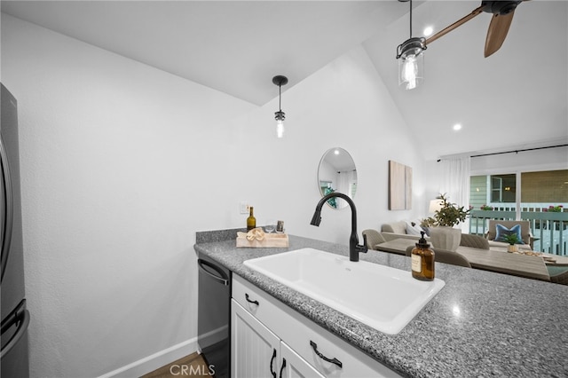 kitchen with dishwasher, vaulted ceiling, white cabinetry, pendant lighting, and a sink