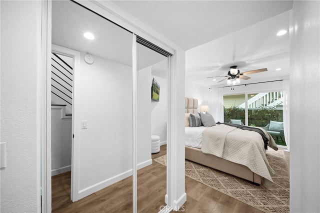 bedroom with ceiling fan, recessed lighting, wood finished floors, and baseboards