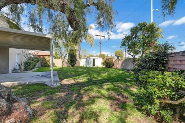 view of yard featuring a patio area and a fenced backyard