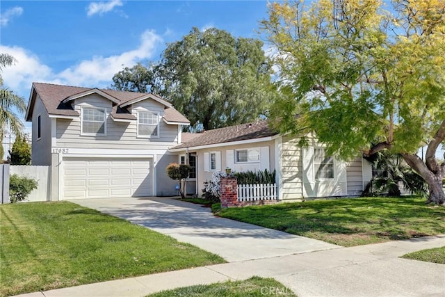 traditional-style home featuring a garage, concrete driveway, a front yard, and fence