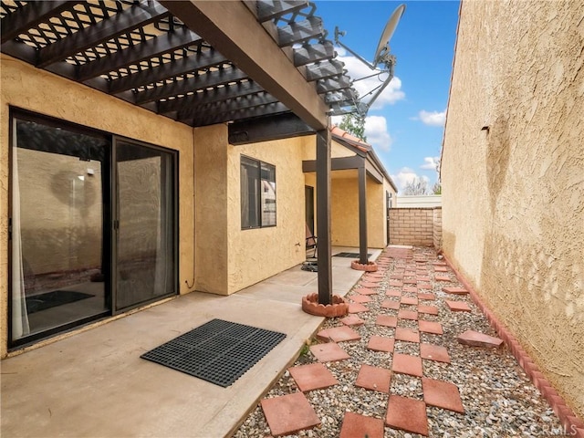 view of patio with fence and a pergola