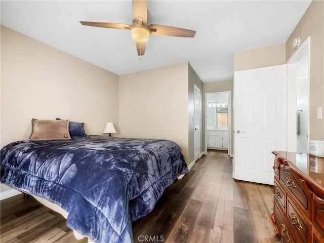 bedroom featuring ceiling fan, wood finished floors, and baseboards