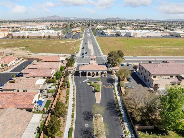 drone / aerial view featuring a residential view and a mountain view