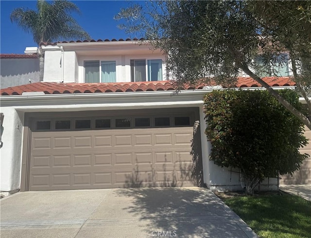 garage featuring driveway