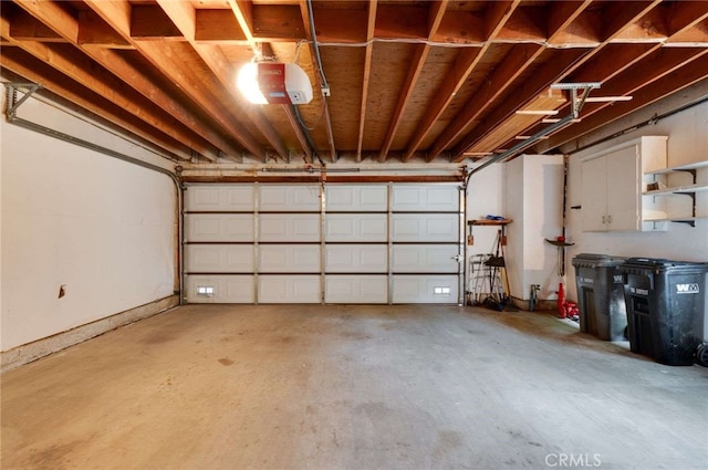 garage featuring a garage door opener