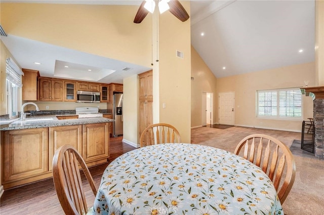 dining space with high vaulted ceiling, baseboards, visible vents, and recessed lighting