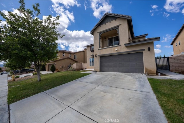 view of front of property with a garage, driveway, a front yard, and stucco siding