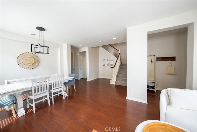 dining room with stairs, baseboards, wood finished floors, and recessed lighting