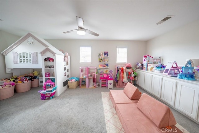 playroom featuring ceiling fan, carpet floors, and visible vents