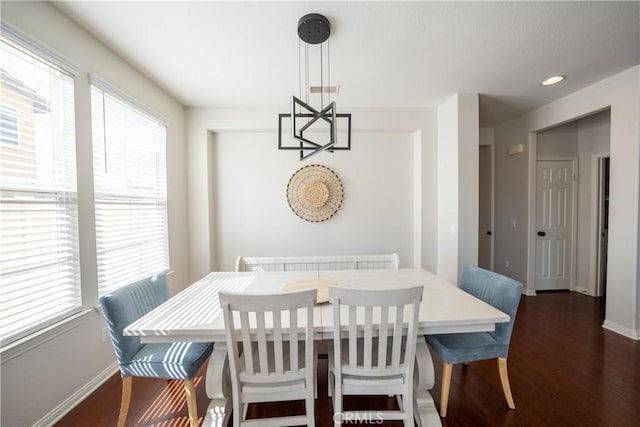 dining room featuring dark wood-type flooring, recessed lighting, visible vents, and baseboards