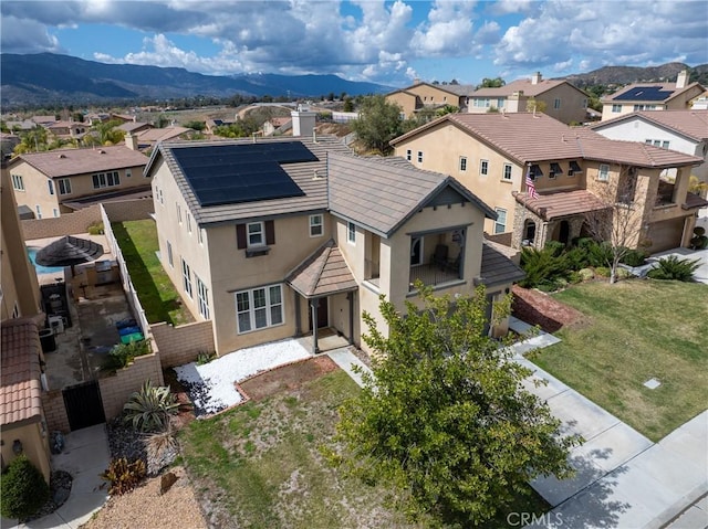 bird's eye view with a residential view and a mountain view