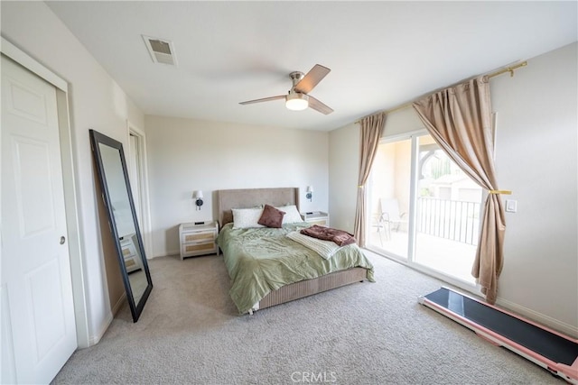 carpeted bedroom with ceiling fan, access to outside, and visible vents