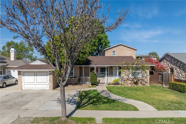 view of front of property featuring stucco siding, a porch, concrete driveway, a garage, and a front lawn