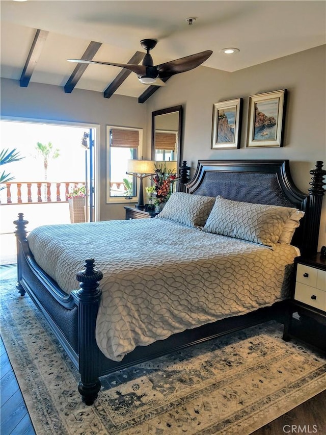 bedroom featuring lofted ceiling with beams, ceiling fan, and wood finished floors