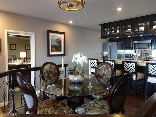 dining room featuring recessed lighting and wood finished floors