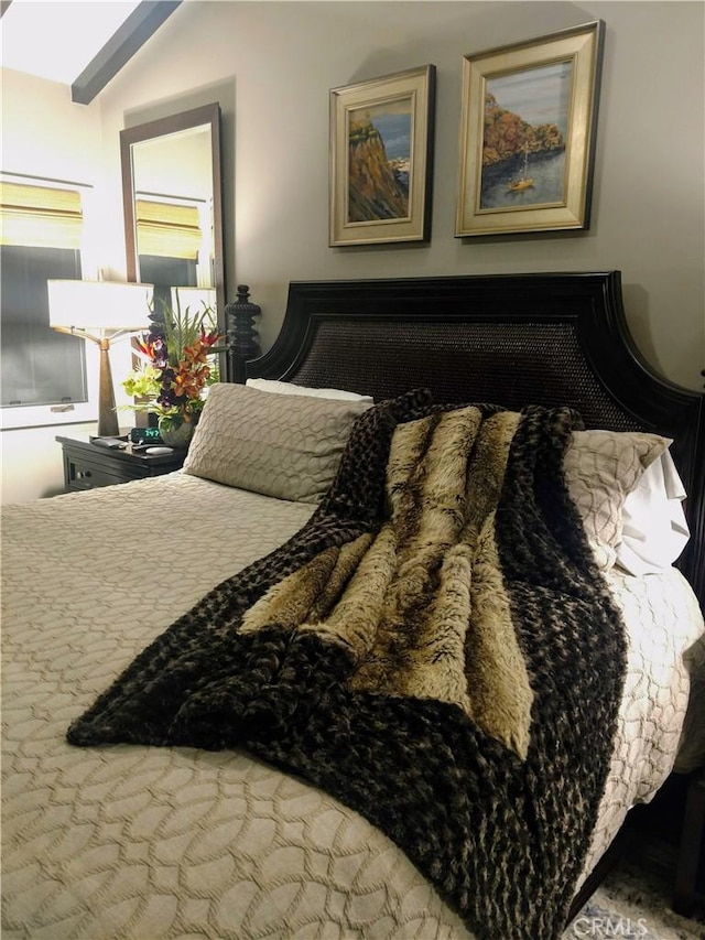 bedroom featuring vaulted ceiling