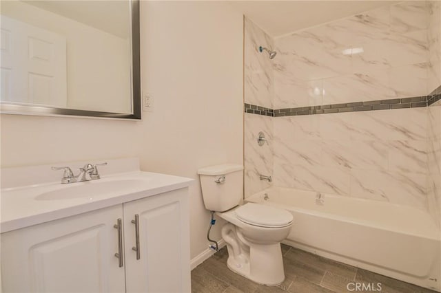 full bathroom with bathtub / shower combination, wood finish floors, vanity, and toilet