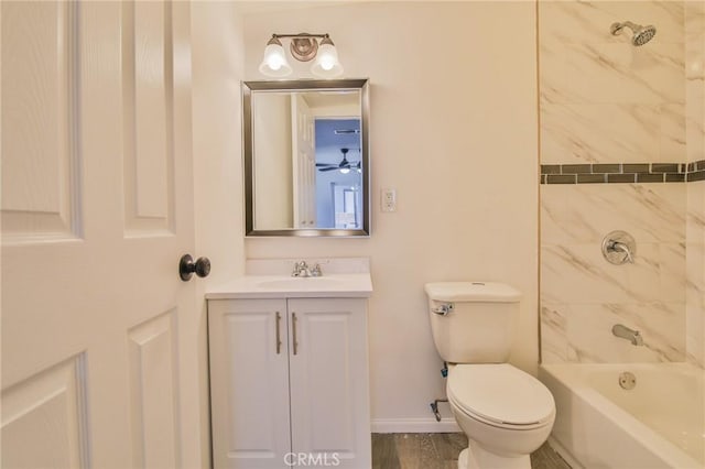 full bath with shower / bathtub combination, toilet, wood finished floors, vanity, and baseboards