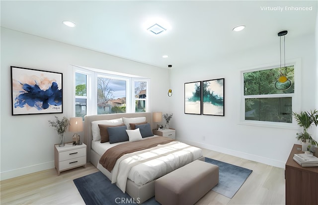 bedroom with baseboards, recessed lighting, and light wood-style floors