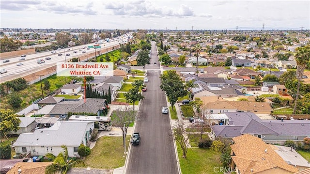 birds eye view of property with a residential view