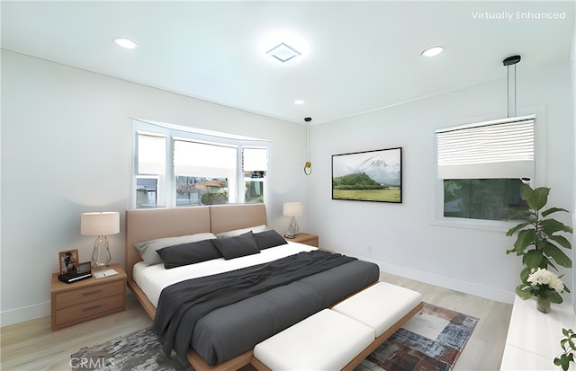 bedroom with light wood-style floors, recessed lighting, and baseboards