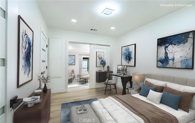 bedroom with recessed lighting, visible vents, and light wood-style floors