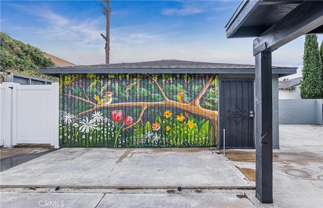 view of gate featuring fence