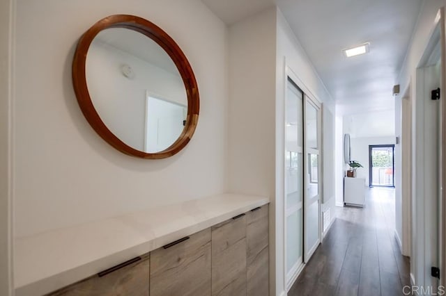 hallway with dark wood-type flooring