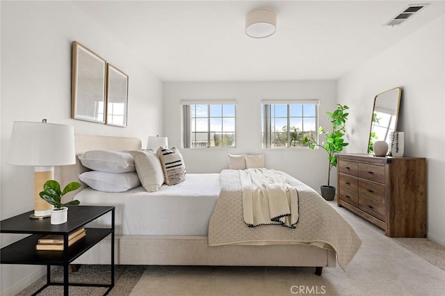 carpeted bedroom with visible vents