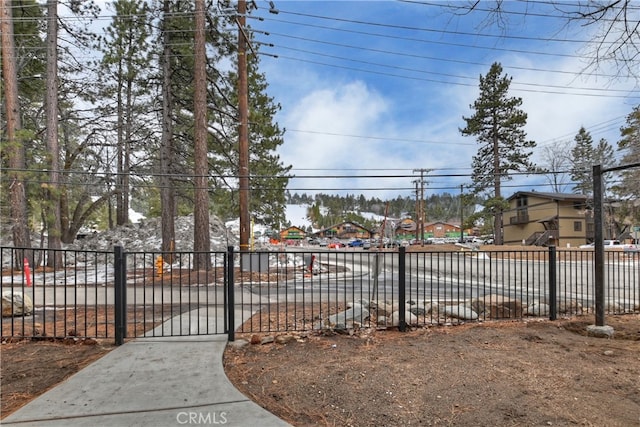 view of gate with fence