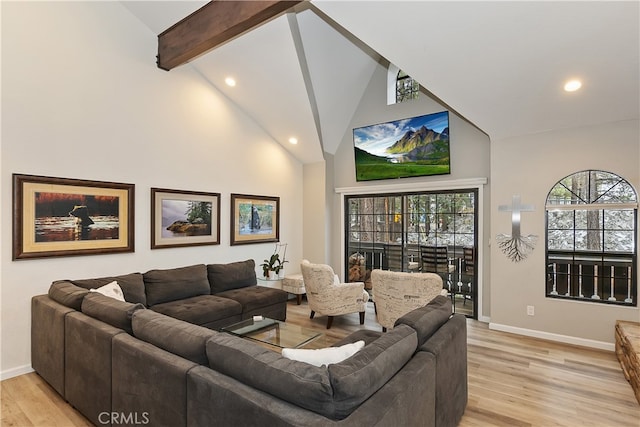 living area featuring high vaulted ceiling, beamed ceiling, light wood-type flooring, and baseboards