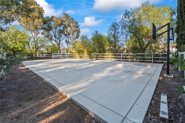 exterior space with community basketball court and fence