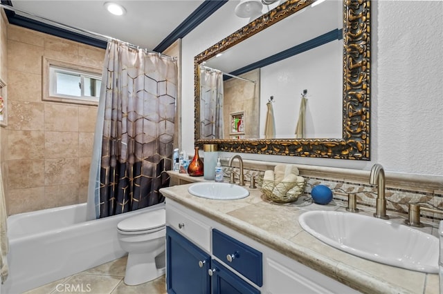 full bath featuring double vanity, toilet, shower / bath combo, and a sink