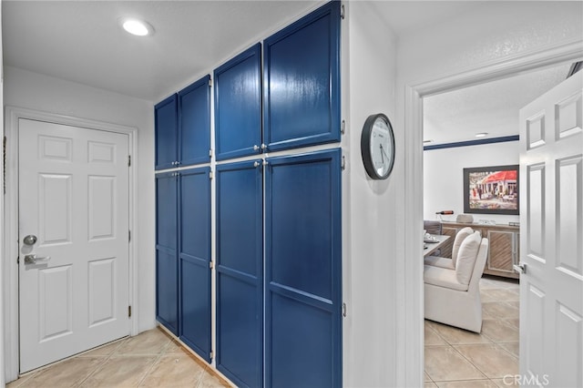 interior space with light tile patterned floors and recessed lighting